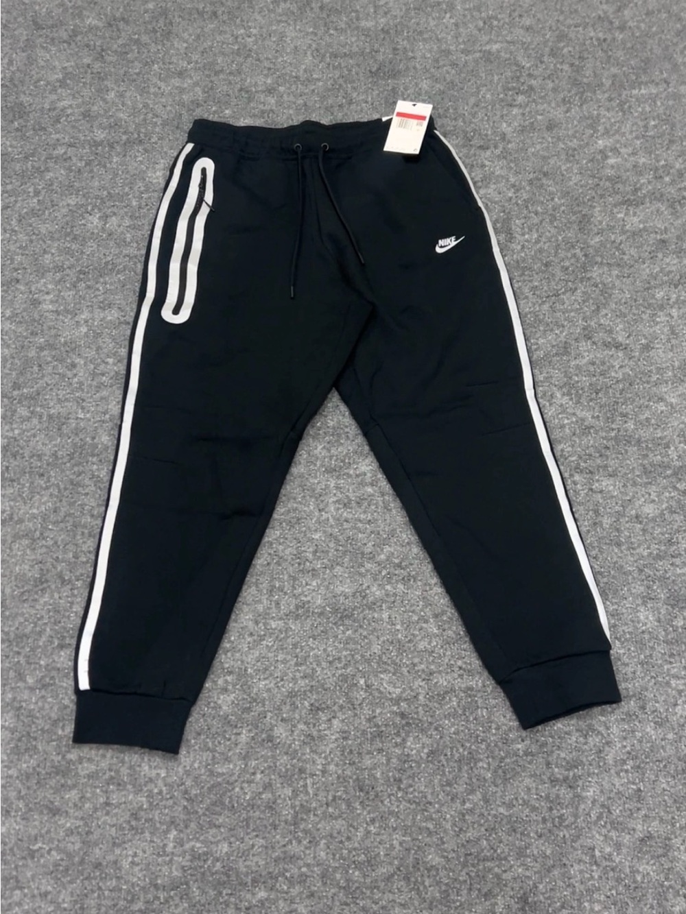 Nike Black Joggers with White Side Stripes - man